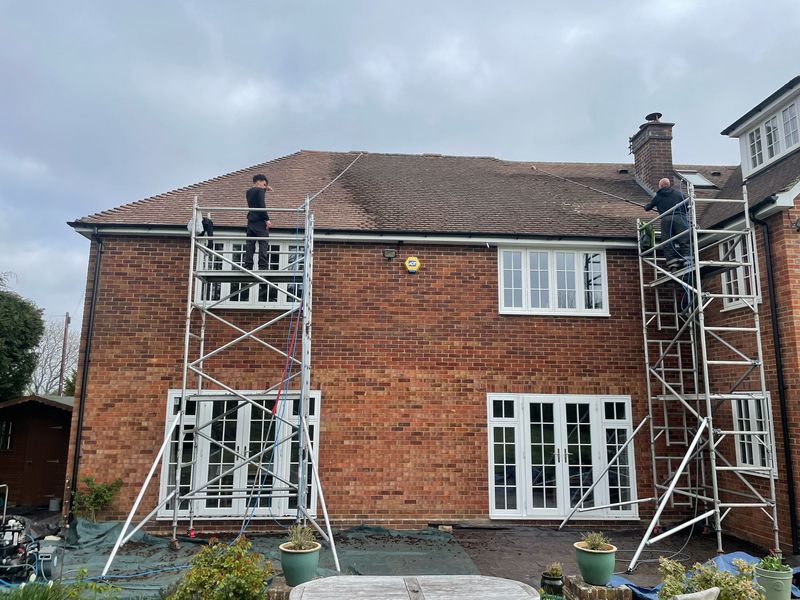 Roof cleaning carried out safely from scaffold towers by The Roof Moss Cleaners in Houghton Regis